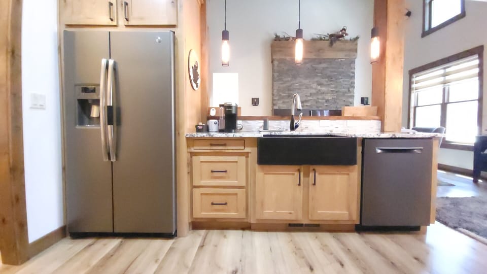 Flawless visual flow from the kitchen directly to the cozy stone hearth.