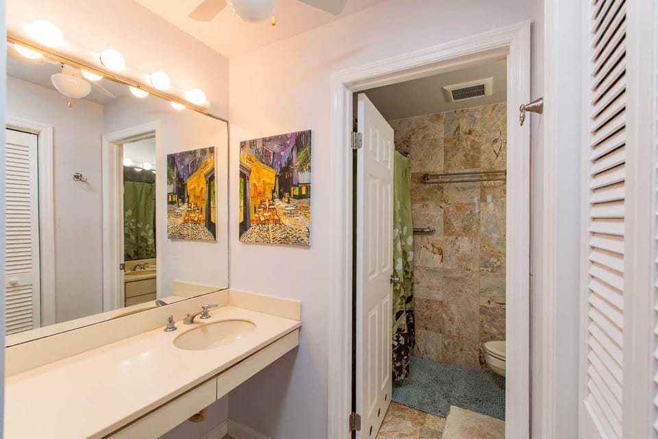 Outside the primary bath is a second vanity area with tons of counter space.