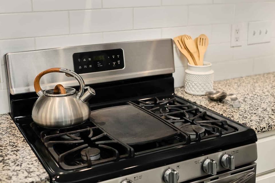 Gas stove and cast iron stove-top griddle. Perfect for your morning pancakes!