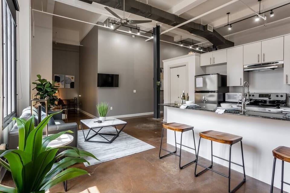 Enjoy the modern kitchen with ample counter space and all the essentials needed to prepare a meal, providing the perfect blend of comfort and convenience in downtown Fort Worth.