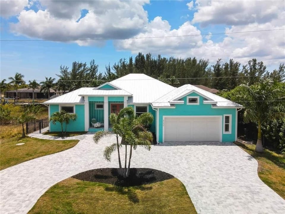 Front of the home wit Large circle driveway