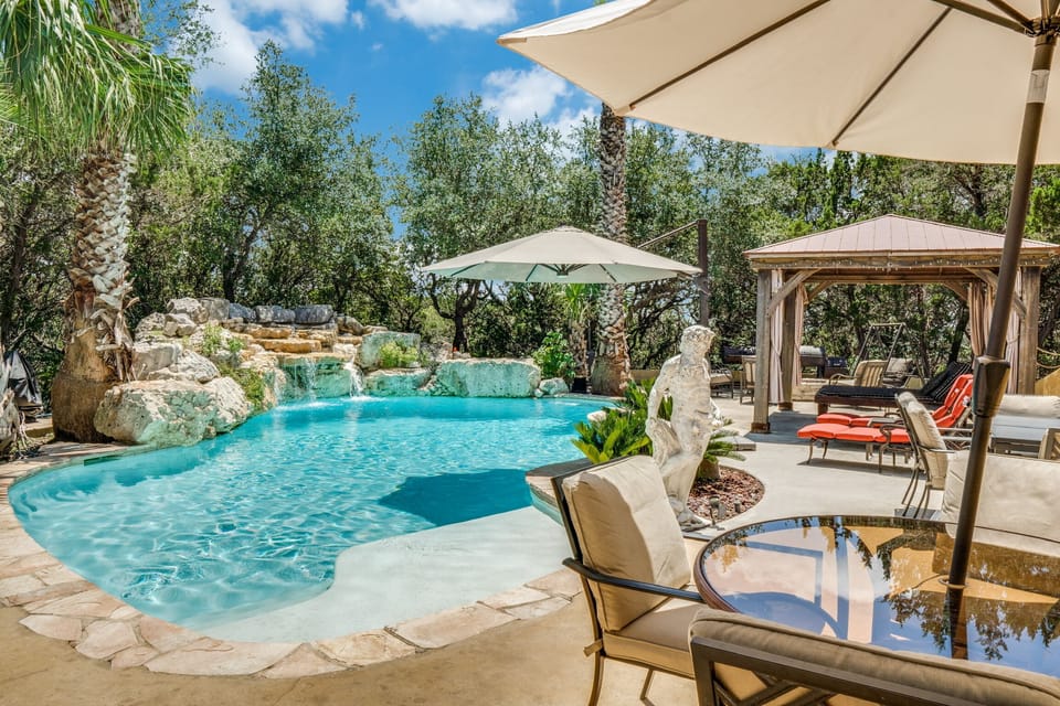 Large Pool Deck with multiple seating and dining options with 2 dining tables.