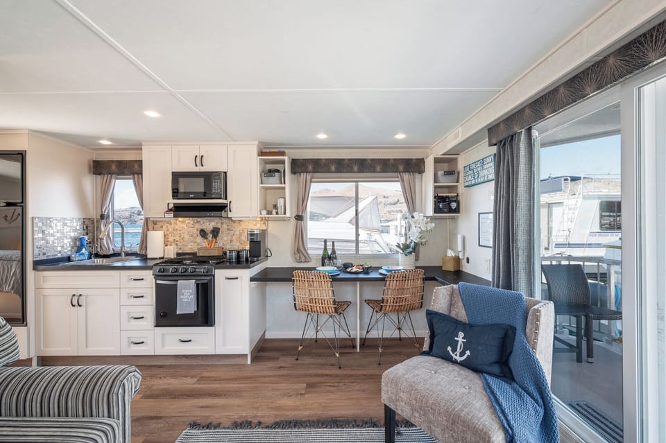 Well stocked kitchen with single-use Keurig coffee maker with pods provided