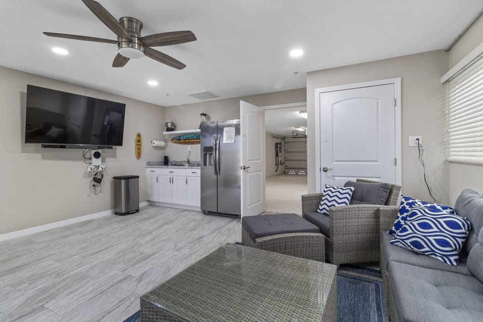 The first floor bonus room has a 65" smart TV, Xbox, refrigerator, and A/C 