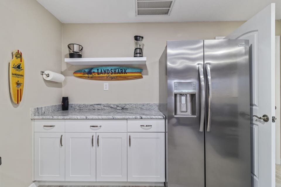 The bonus room has a bar area stocked to enjoy drinks by the pool