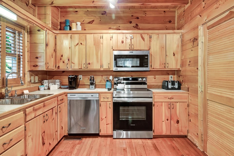 Stainless steel appliances and a fully stocked kitchen make it easy to stay in and cook a fun family meal.