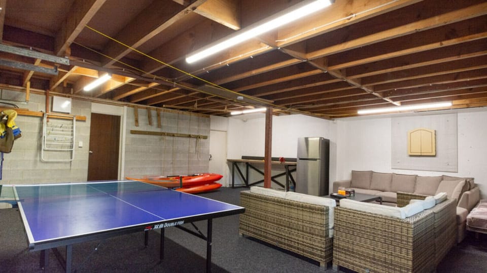 Games room with ping pong, darts and kayaks