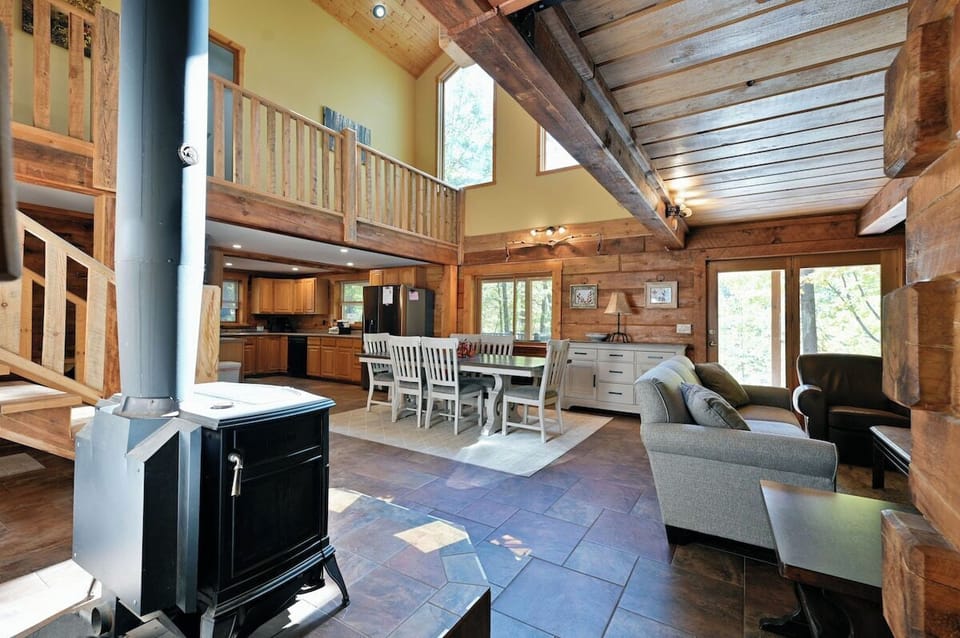 Whispering Waters Lodge has a open-concept kitchen, living room, and dining area giving plenty of room for everyone to stretch out.