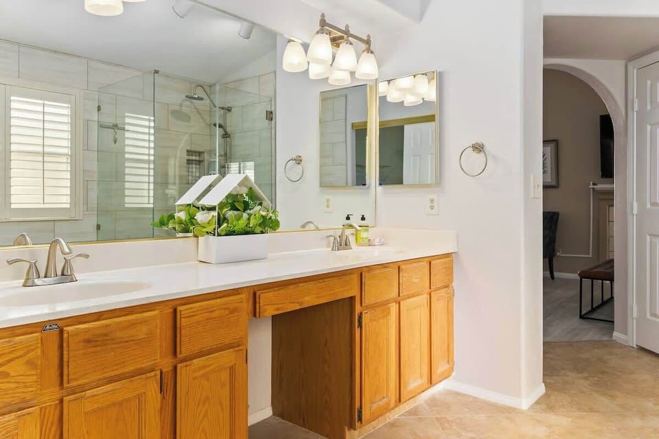 His and her vanity mirror, a luxurious bathtub, shower, thoughtful accents, plus towels and toiletries to complete your bathroom experience to either start or end your day here.

