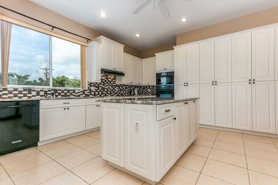 Chef's Setup: Newly renovated with modern appliances, ample counter space, and plenty of storage for a month's worth of groceries.