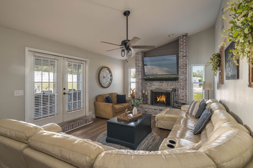 Enjoy a comfy sectional 65" TV w/Disney+ & YouTubeTV. Wood fireplace.