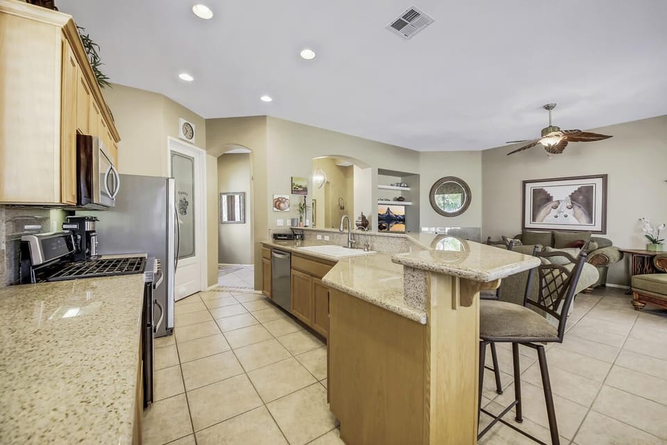Enjoy your morning coffee at the 15' breakfast bar w/views of the back yard