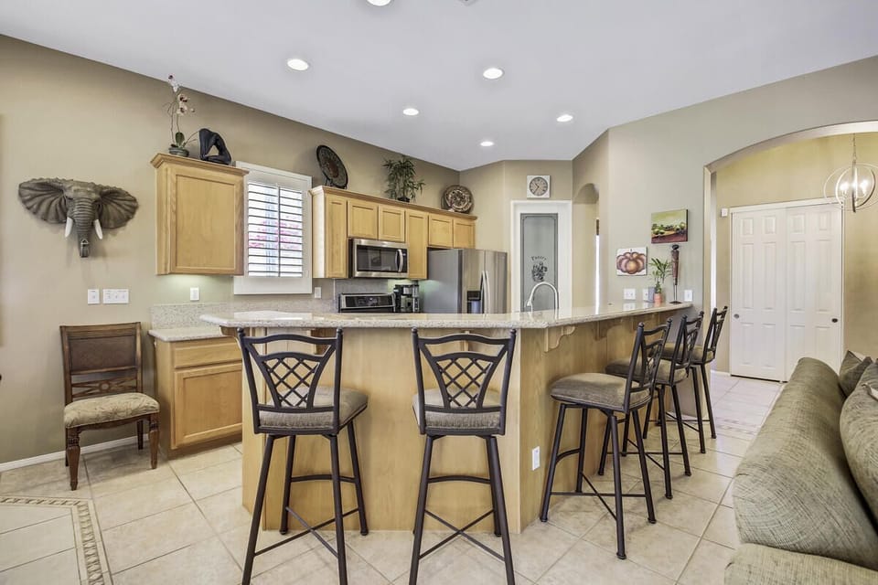 Kitchen with new stainless steel appliances and 15' breakfast bar