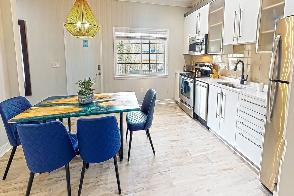 Full size Kitchen is open with a stunning large dining table for 6.  Handmade by the owners of the property!