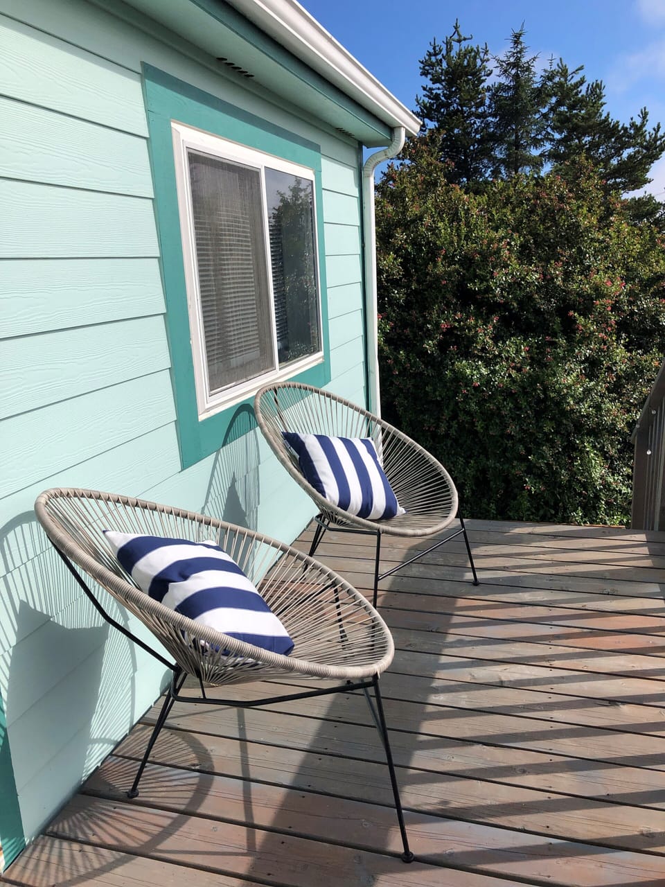 Lounge chairs in front of the house.