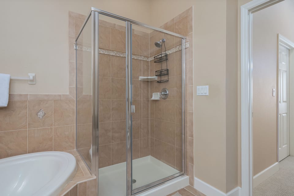 Master Bathroom with double vanity, soaking tub and separate shower.