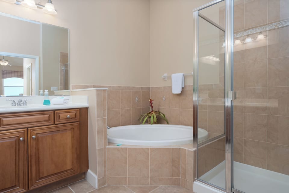 Master Bathroom with double vanity, soaking tub and separate shower.