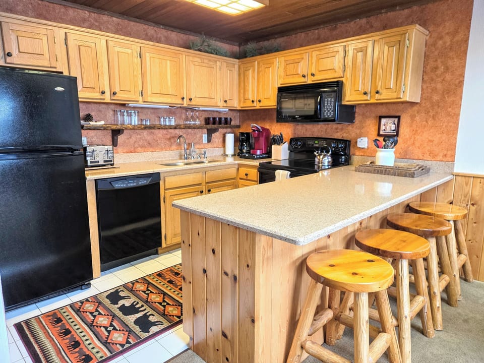 Fully Stocked Kitchen, Including a Kuerig Coffee Maker with a Selection of K-Cups.