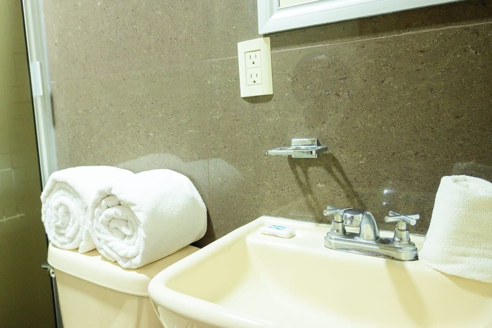 Comfort Double Room, 2 Double Beds | Bathroom | Towels, soap, shampoo, toilet paper