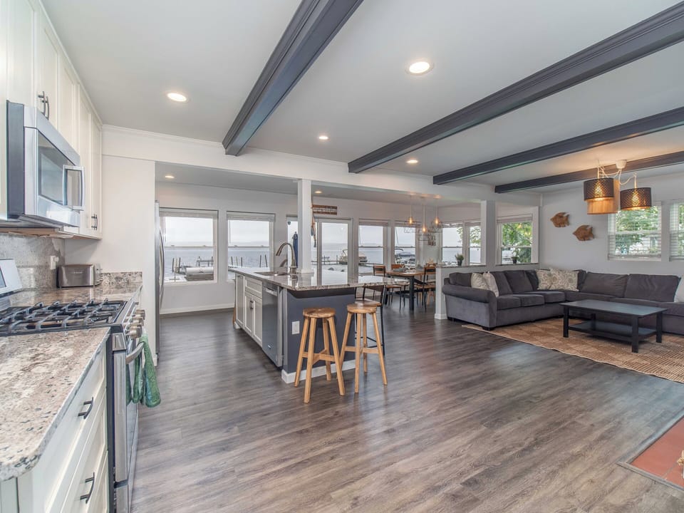 Open concept first floor living area with ample seating and comfortable couch (2)