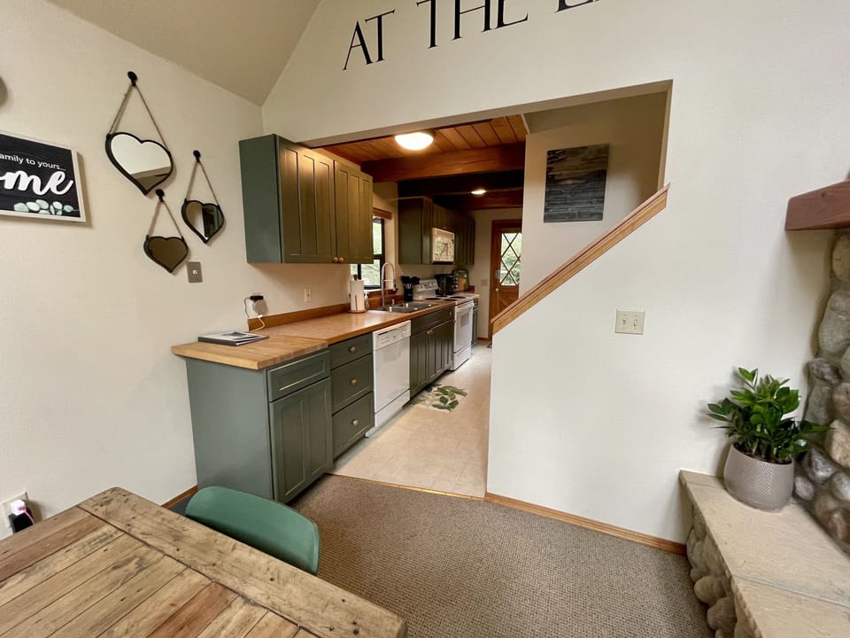 cute, green, galley style kitchen 