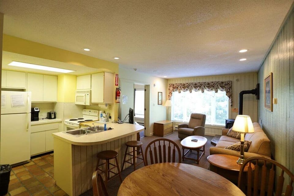 Open Living Room with Dining Table in Condo in Waterville Valley