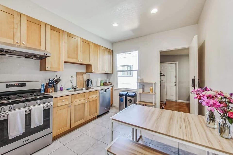 Well appointed kitchen with a dining table for 4.  We provide coffee, tea, sweeteners and dishwasher pods. (the 4th bedroom off the kitchen can be seen here)