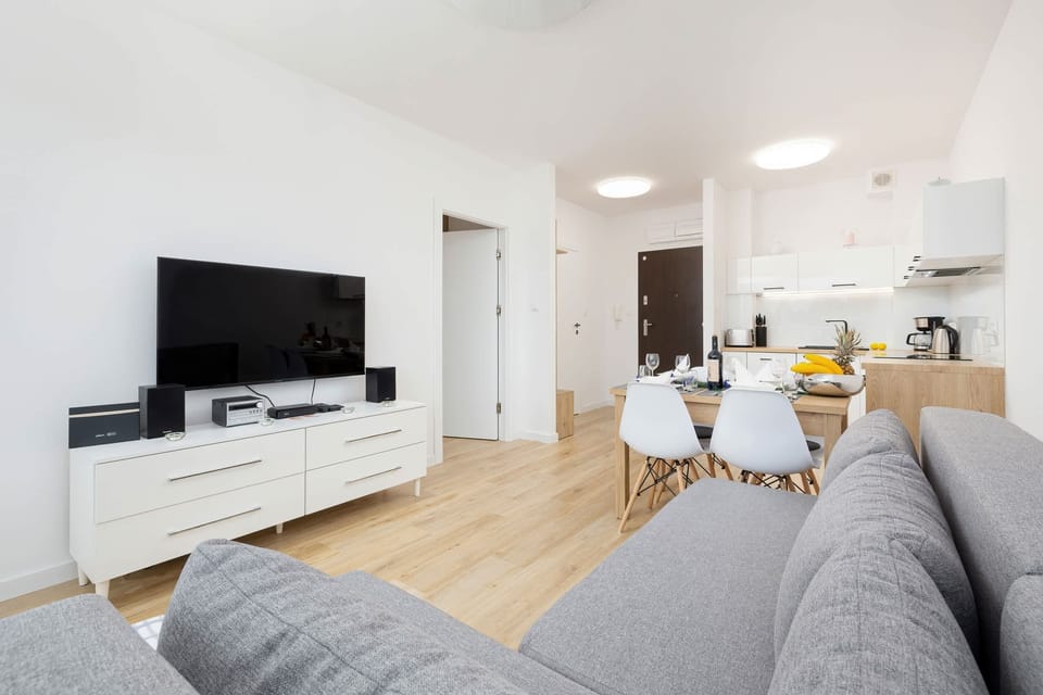 Fully equipped kitchen with sleek cabinets and appliances