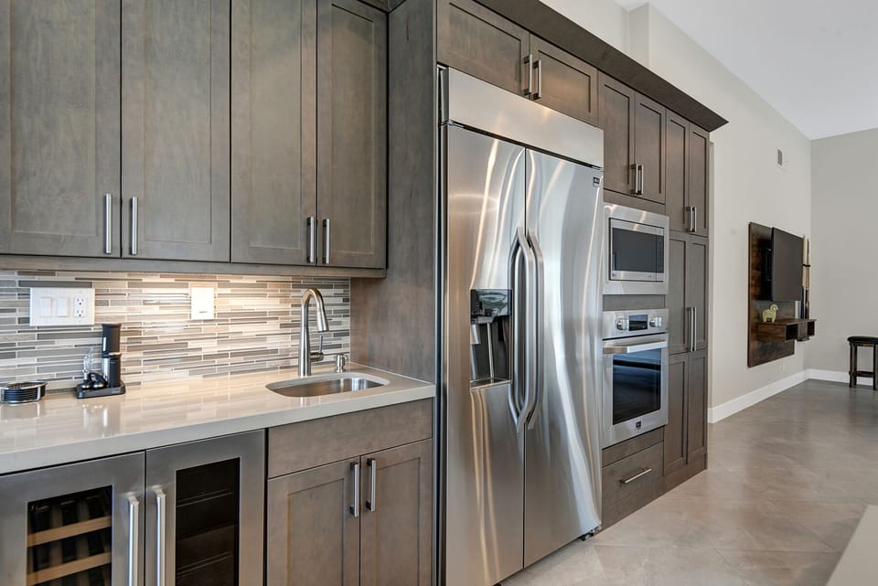 KITCHEN BAR SINK AND FRIDGE
