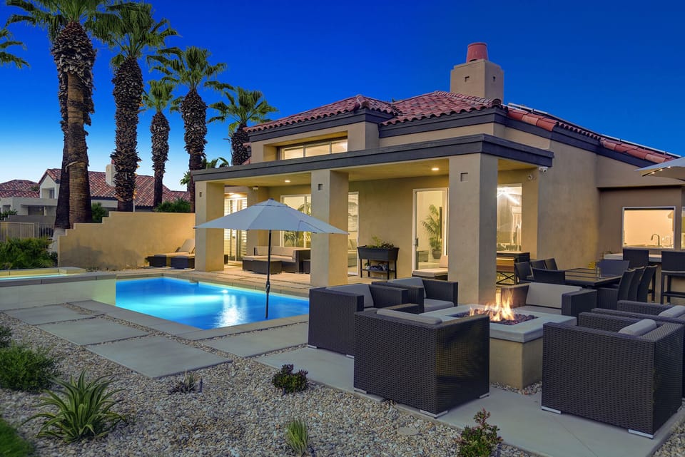FIRE PIT TO POOL AND BACK OF HOUSE