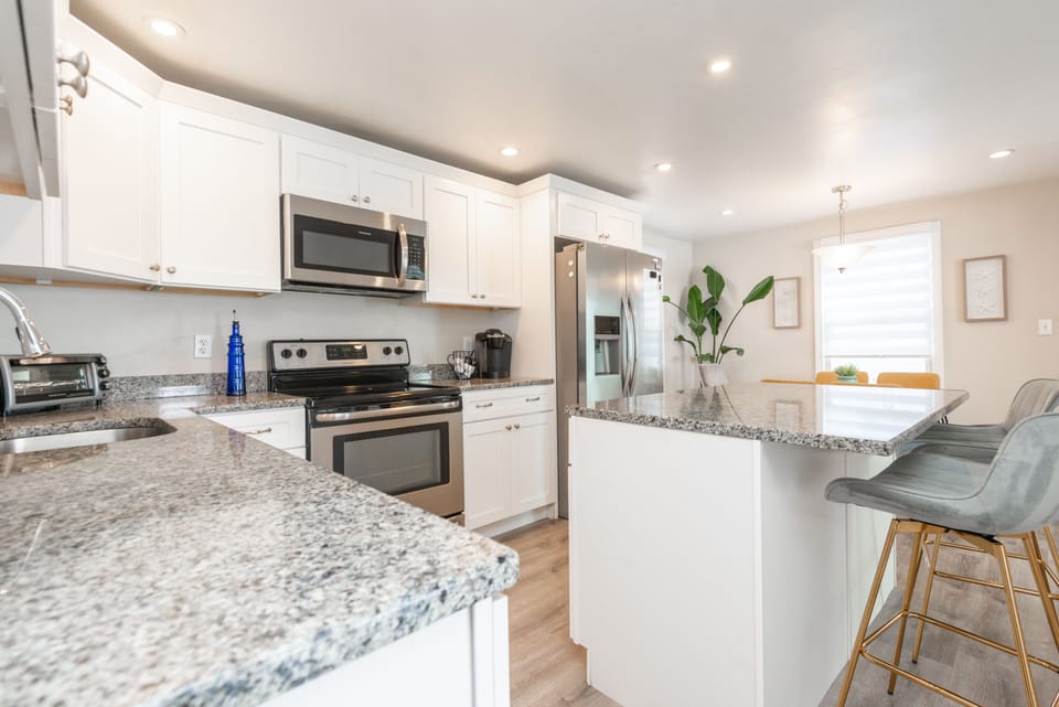 Fully stocked kitchen, electric stove