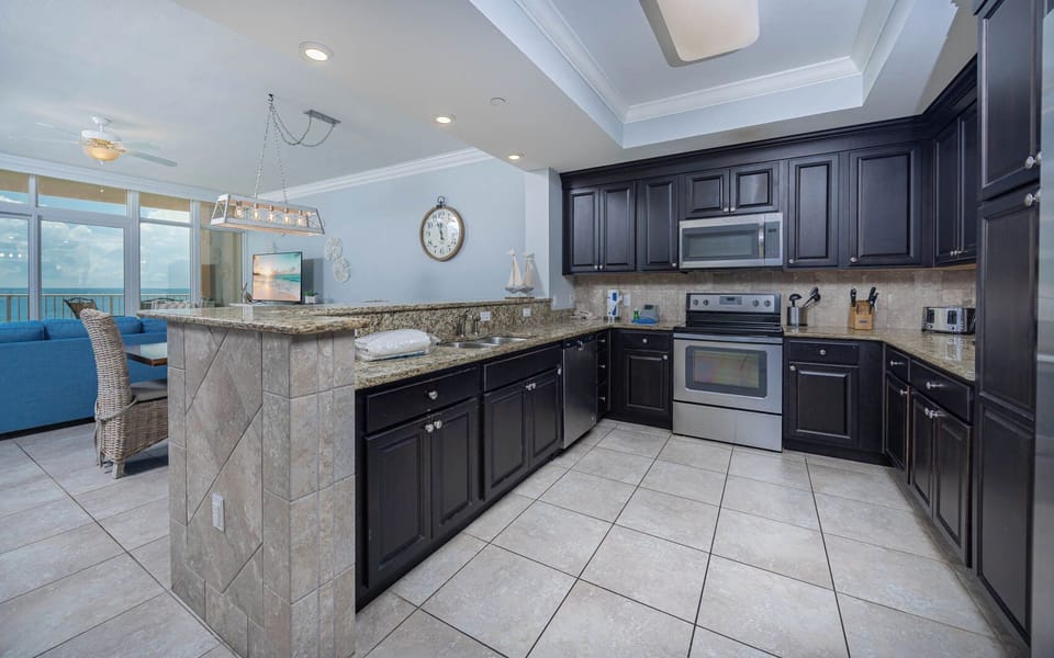 Cook and gather in this inviting kitchen, featuring granite counters and a spacious layout for meal preparation