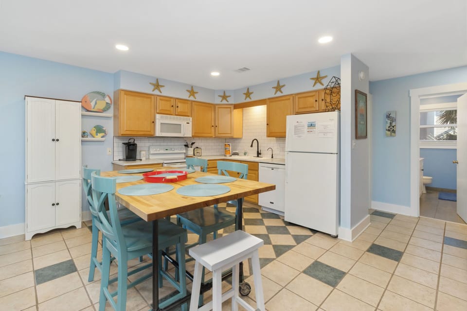 Your updated kitchen with bar seating is a place you actually want to hang out in — morning coffee never tasted so good.