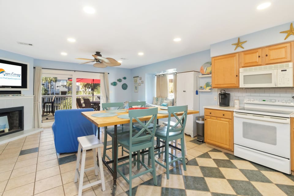 Your sightline from the kitchen stretches right into the living area — stay connected to the group while you cook.	