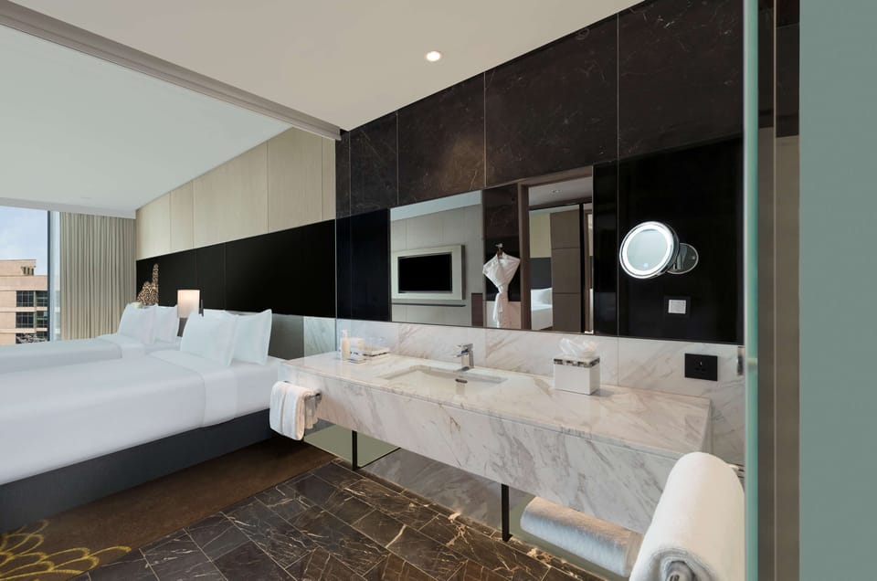 Designer toiletries, hair dryer, bathrobes, slippers