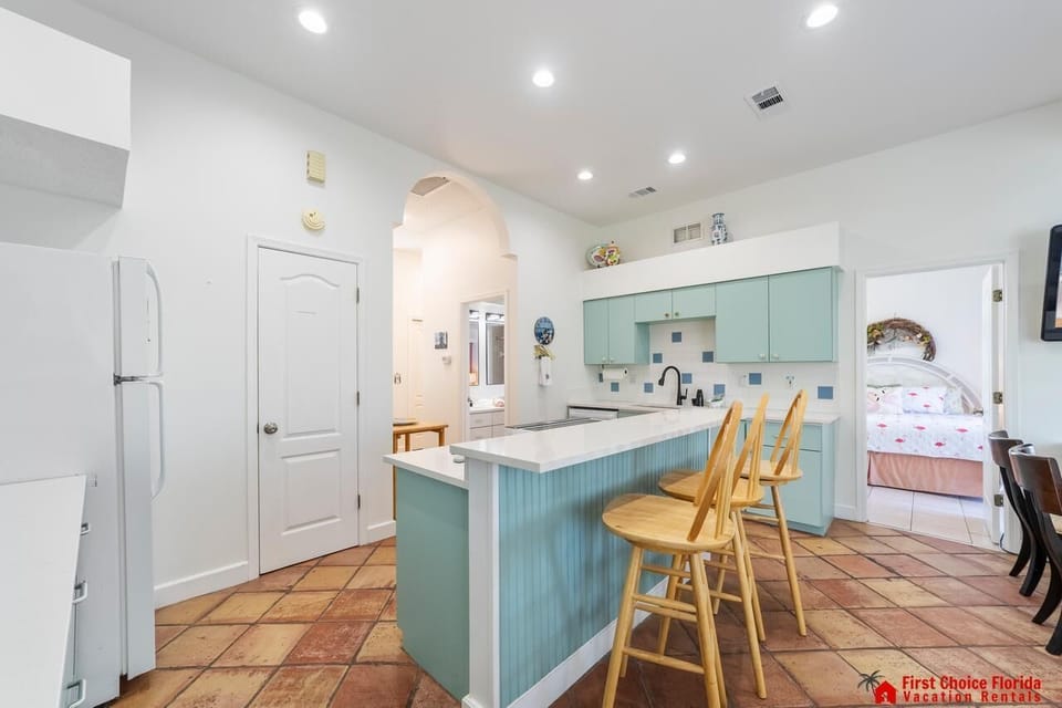 Bright, airy kitchen with cozy breakfast bar seating