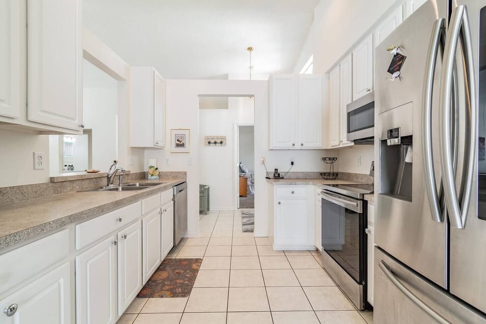 The kitchen has all stainless steel appliances.