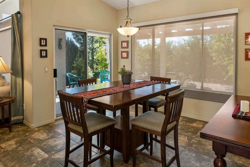 The dining area opens to the undercover outdoor patio