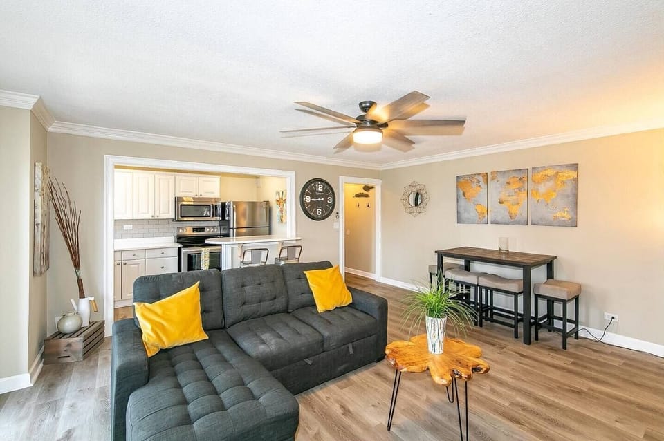 Open living area flows into kitchen & dining space w/ cozy seating & modern touches