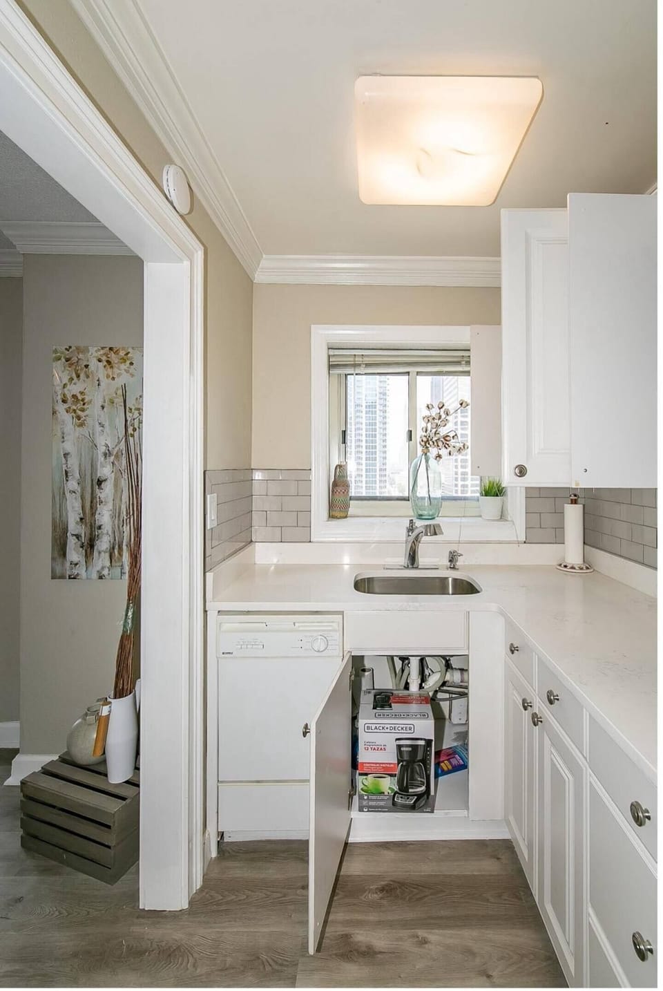 Compact bathroom vanity w/ sink, mirror & clean tiled accents