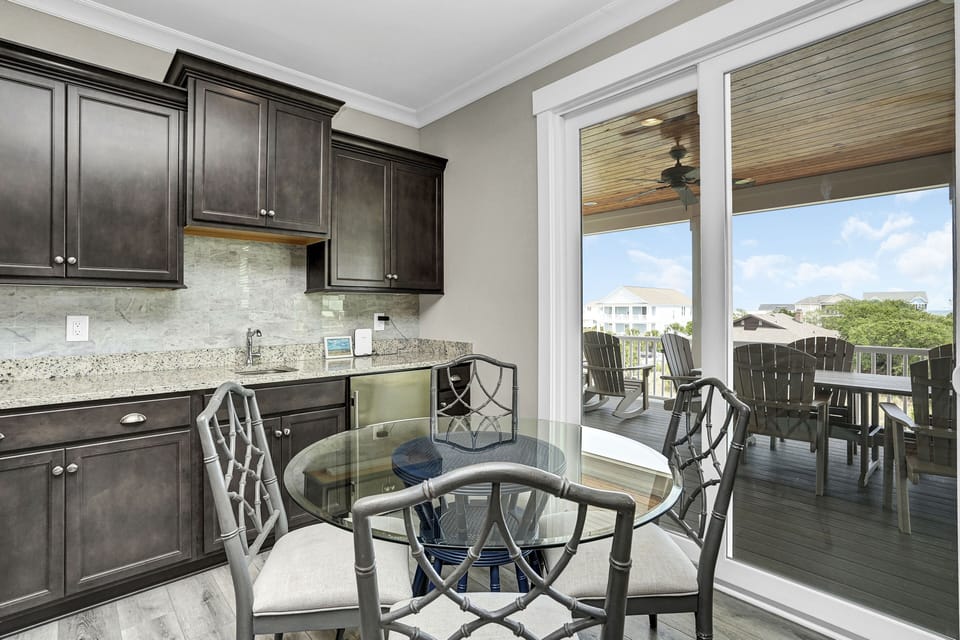 Your elegant kitchen features granite counters and modern appliances, flowing onto your private balcony where you'll enjoy morning coffee with beautiful views.