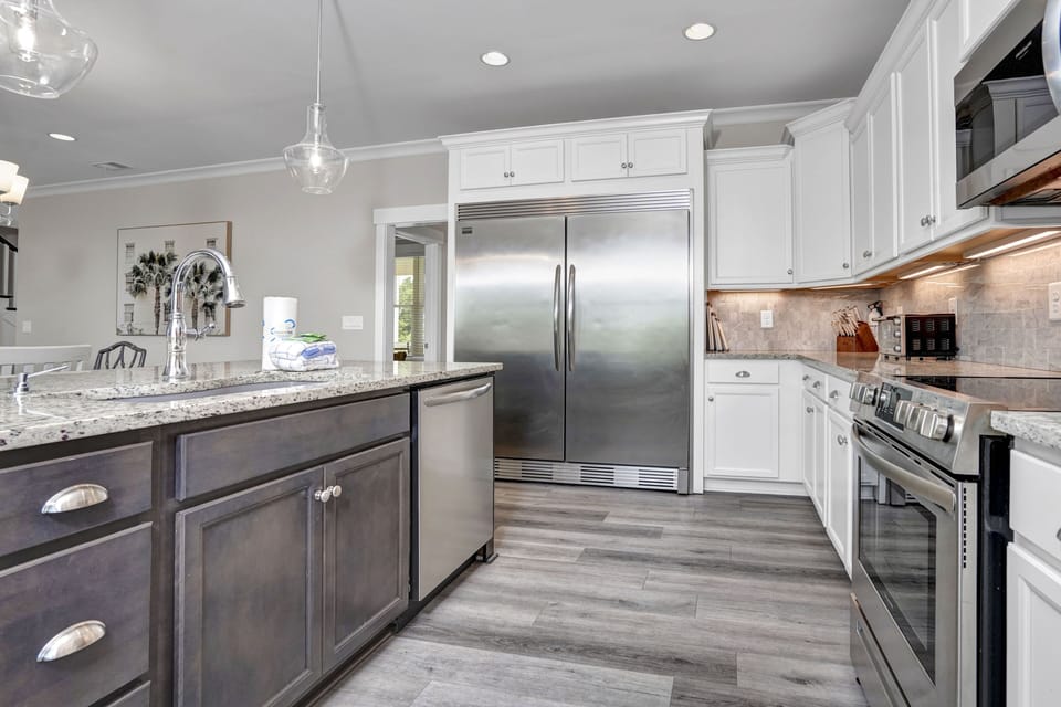 Your gourmet kitchen awaits with granite counters, stainless appliances, and pendant lighting for memorable meal prep.