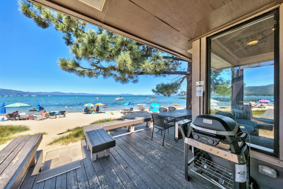 Step onto your private deck with direct beach access—grill dinner while watching boats on crystal blue waters.