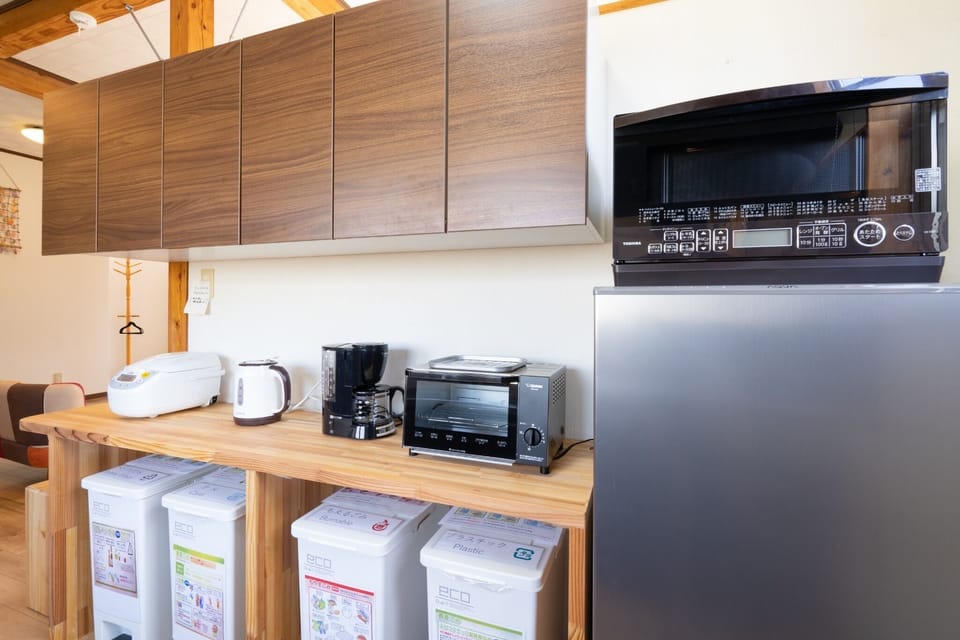 From the left: rice cooker, electric kettle, toaster oven, oven range, refrigerator