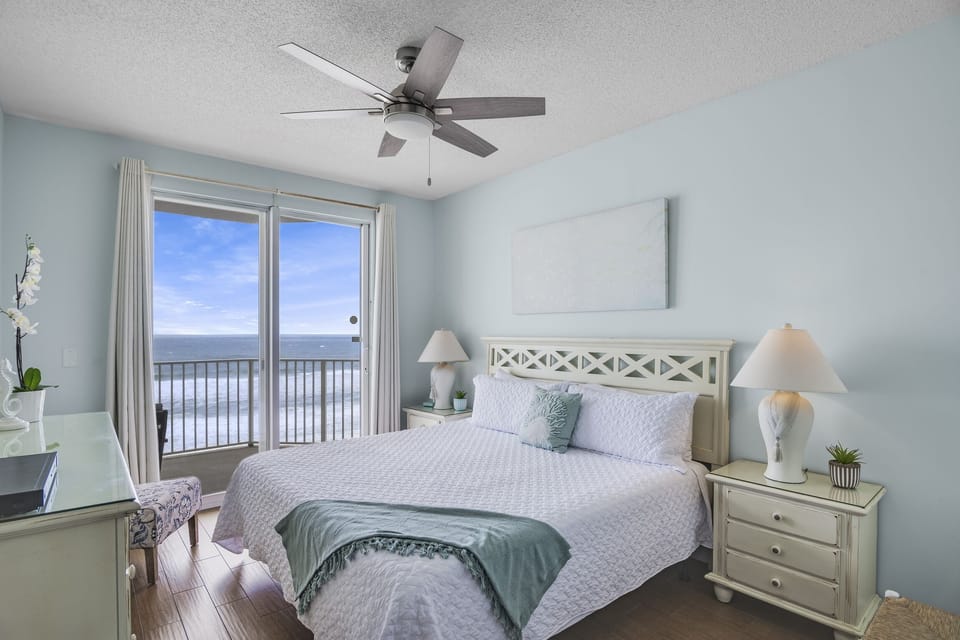 King bed with balcony access in master bedroom (+ TV, private closet with Twin Rollaway bed, and private bathroom) - Wake up to those beautiful Gulf of Mexico views!
