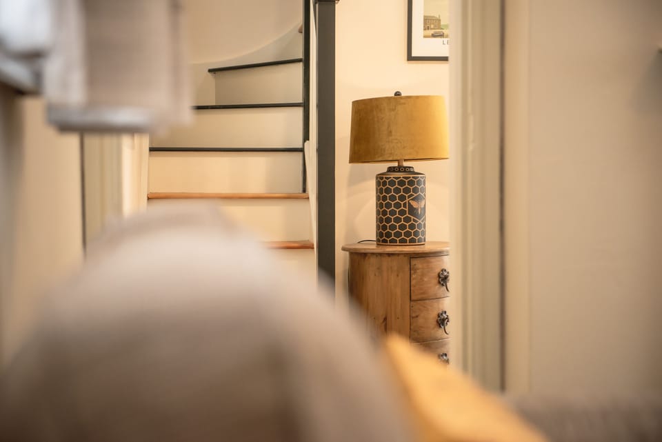 Ground floor: Stairs leading the first floor master bedroom