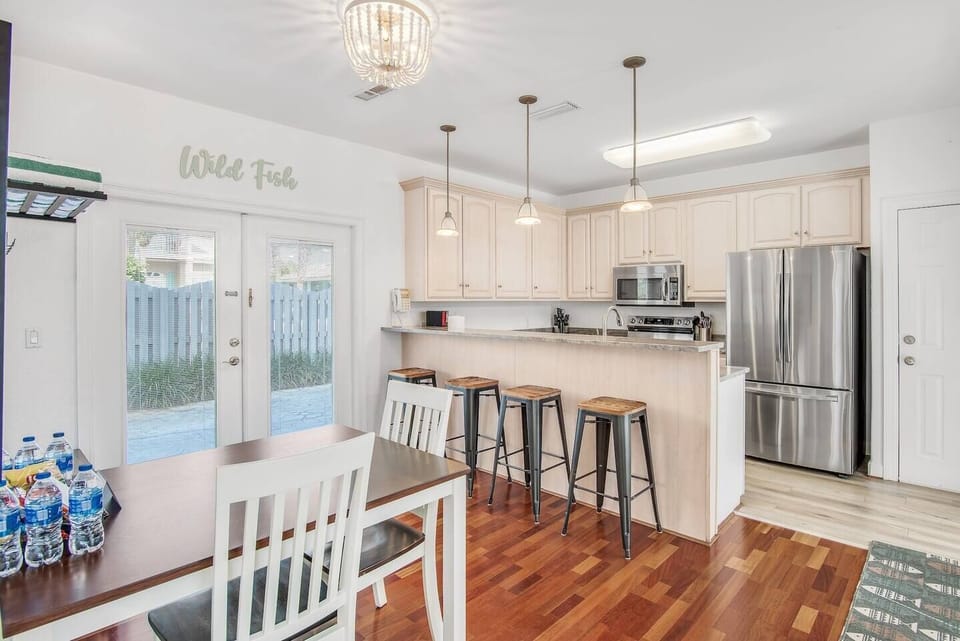 Beautifully remodeled kitchen complete with new stainless steel appliances, new countertops, and new paint with bar and breakfast seating.
