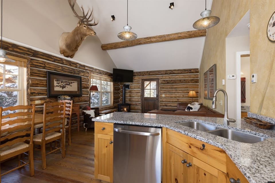 Kitchen opens to living room/dining with granite counter & stainless appliances