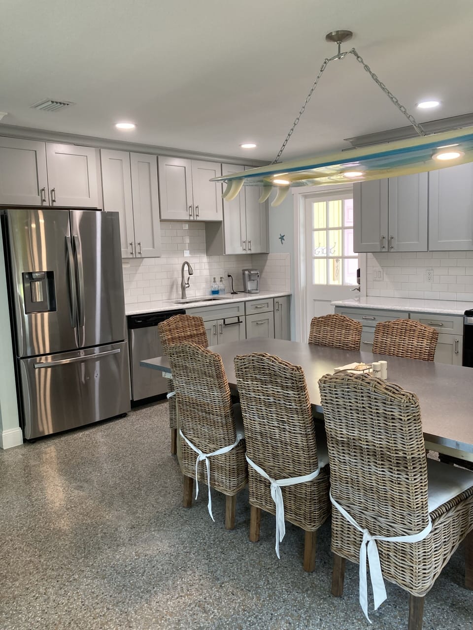 Newly remodeled open kitchen with large table that seats 8 people