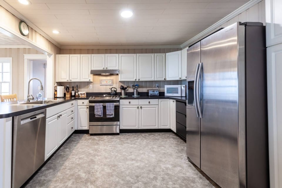 The fully-equipped gourmet kitchen is in the heart of the home.